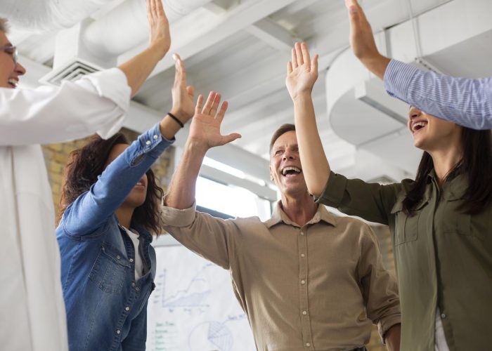people-smiling-while-conference-rom